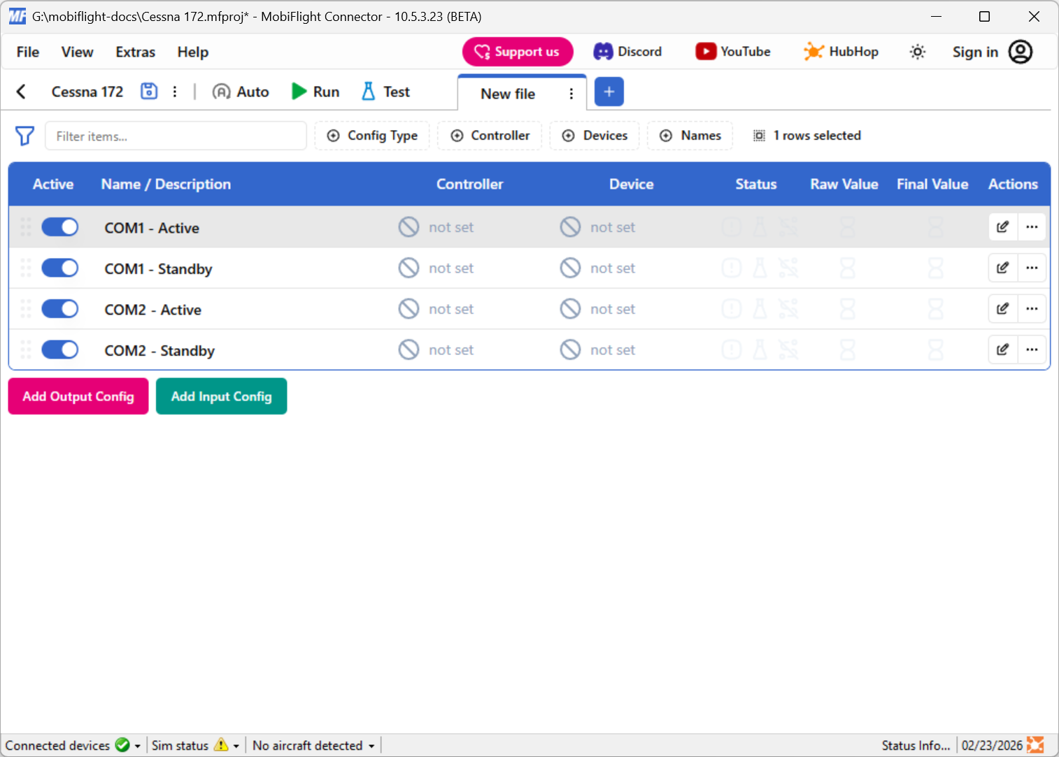 Screenshot of the output tab in the main window four output configurations defined for COM1 and COM2 active and standby frequencies.